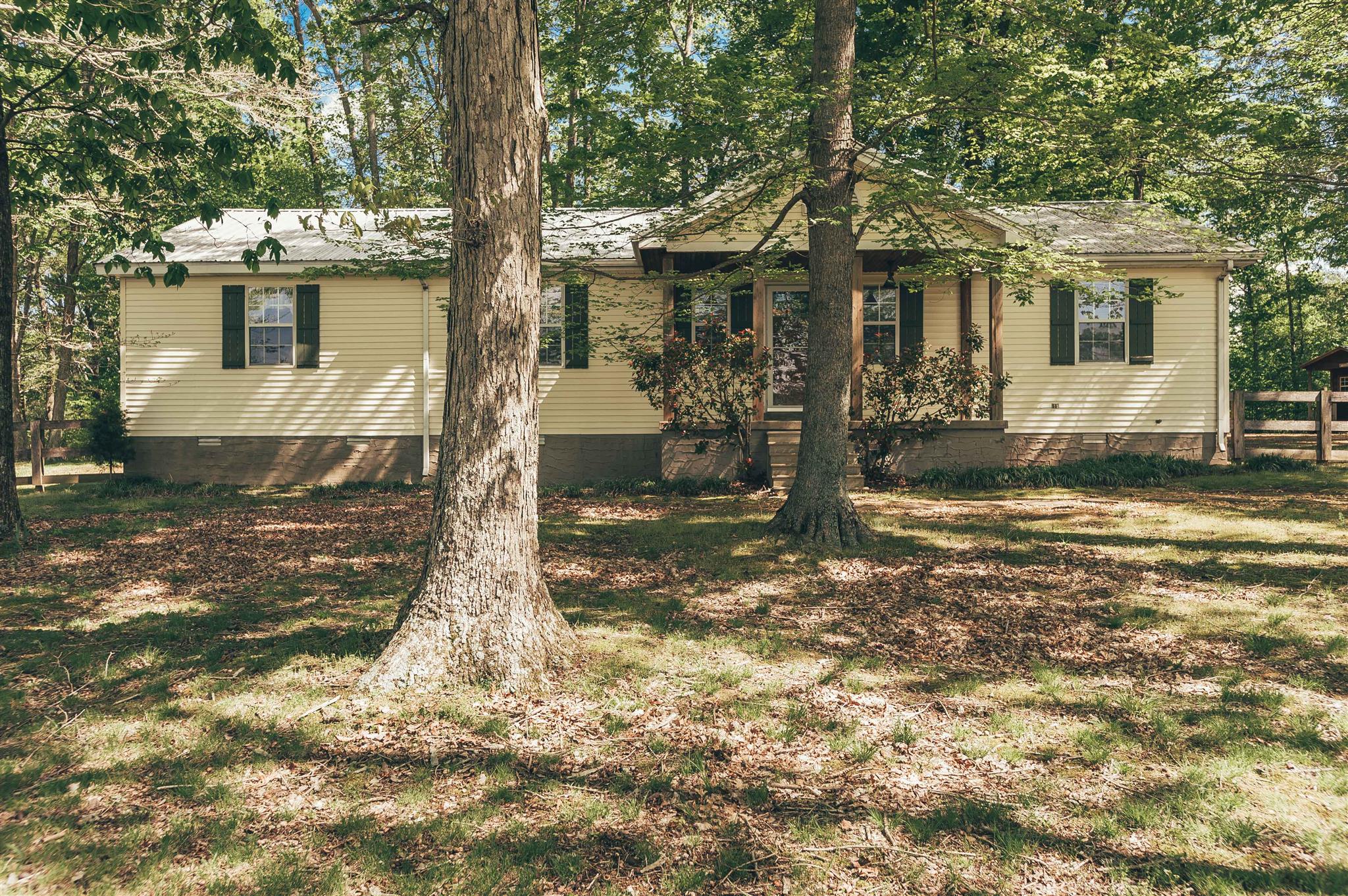 1253 Smith Thompson Road Bethpage, TN 37022 - Photo 1 of 19 a front view of a house with a yard