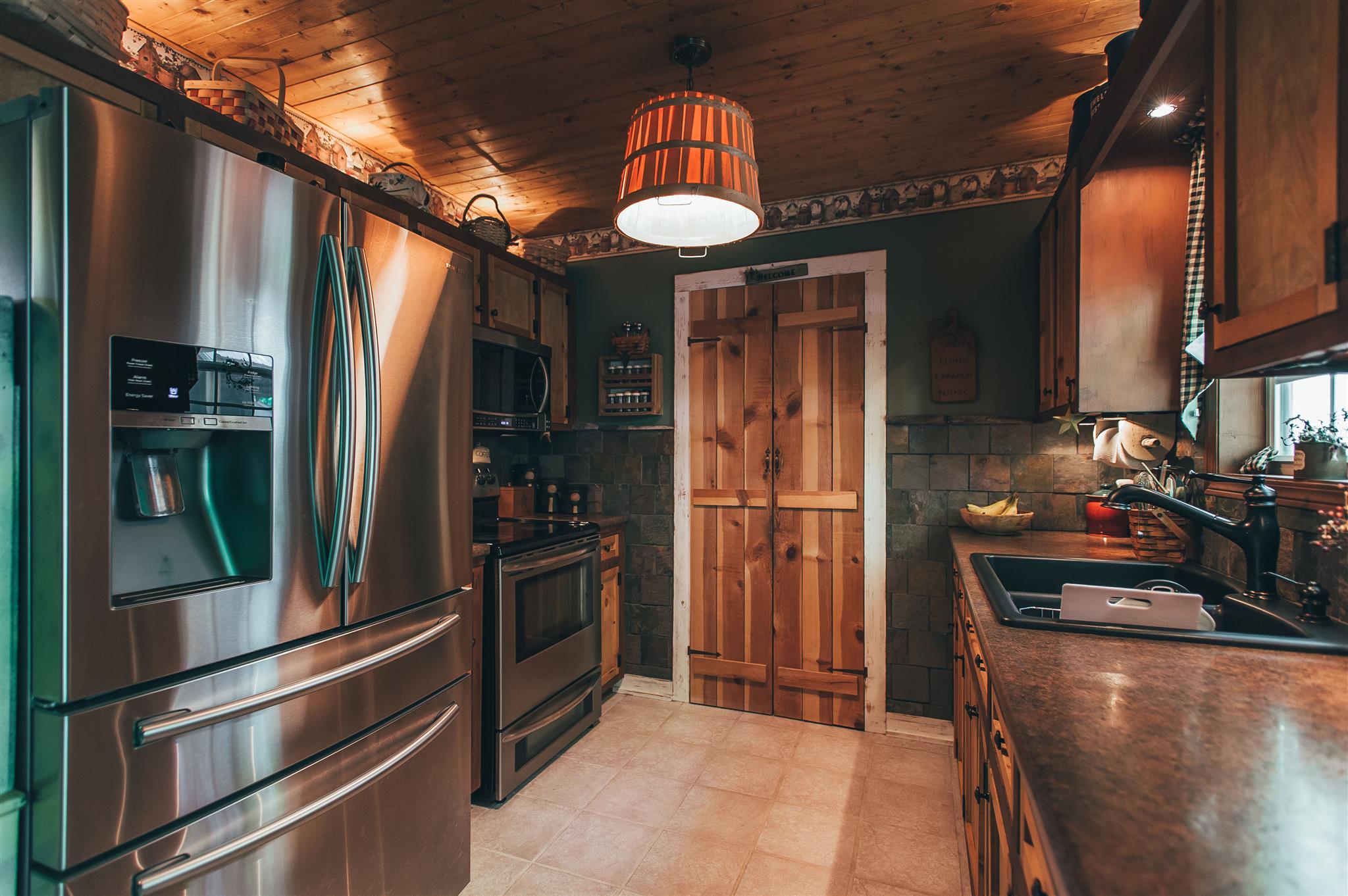 1253 Smith Thompson Road Bethpage, TN 37022 - Photo 8 of 19 a kitchen with stainless steel appliances granite countertop a refrigerator and a sink