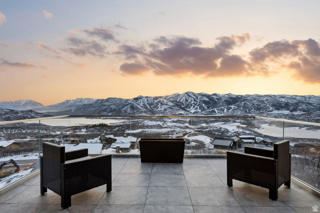 2002 East Outlaw Road Kamas, UT 84036 - Photo 14 of 65 Expansive outdoor terrace featuring large format tile flooring and a glass railing system
