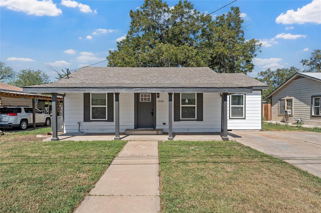 front view of a house with a yard