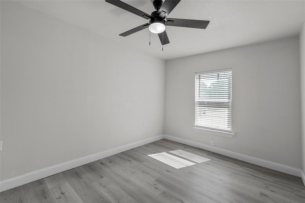 3530 Bluebird Street Bellmead, TX 76705 - Photo 12 of 24 an empty room with a window and a fan