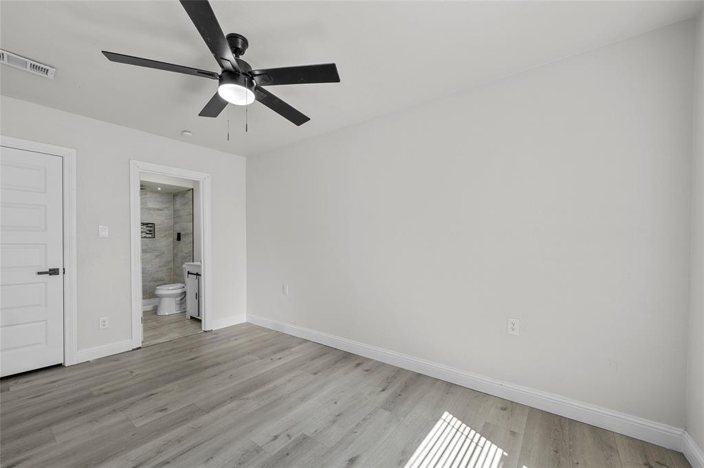 3530 Bluebird Street Bellmead, TX 76705 - Photo 15 of 24 a view of an empty room and wooden floor