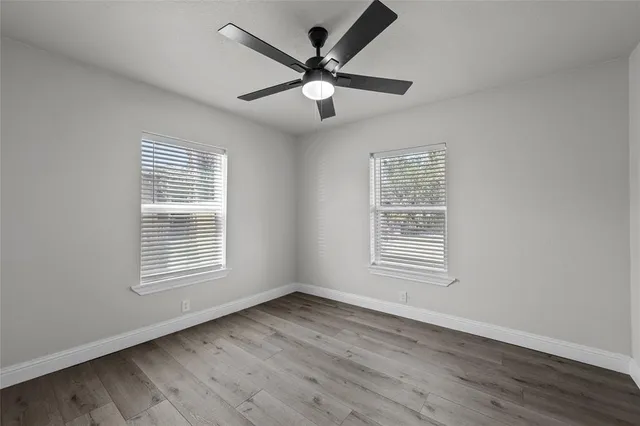 a bathroom with a double vanity sink toilet and shower