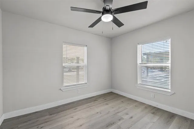 a view of a house with a yard and garage
