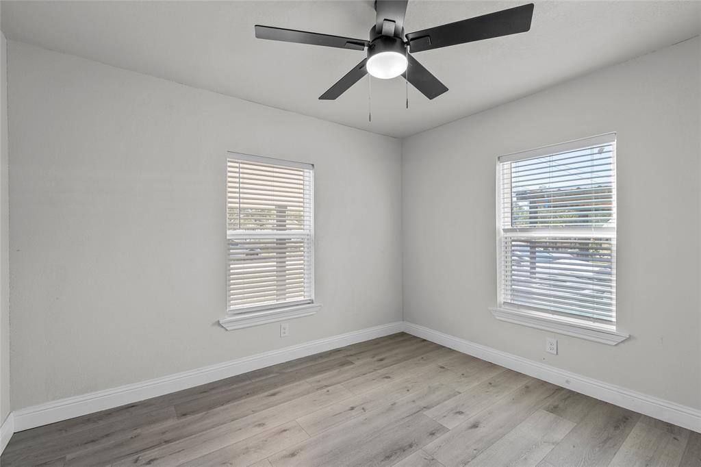 3530 Bluebird Street Bellmead, TX 76705 - Photo 20 of 24 a view of an empty room with wooden floor and a window