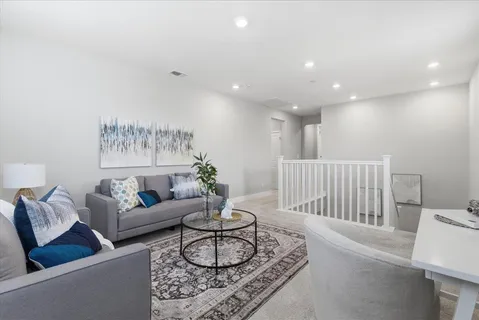 a living room with furniture and a table