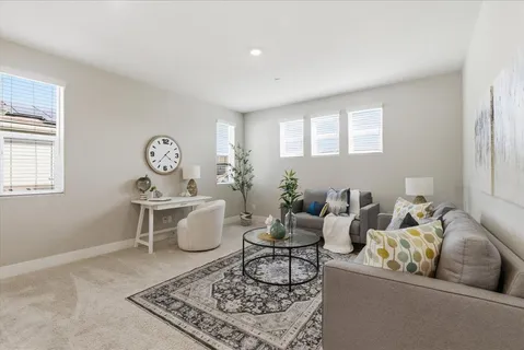 a living room with furniture and window