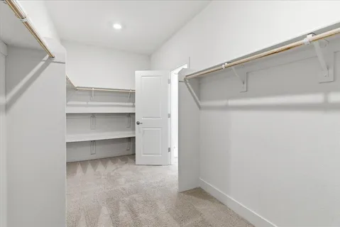 a view of an empty walk in closet