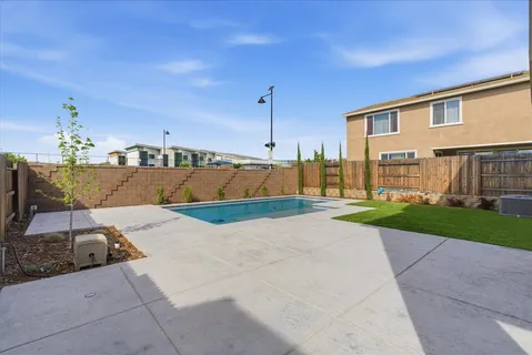 a view of backyard with patio