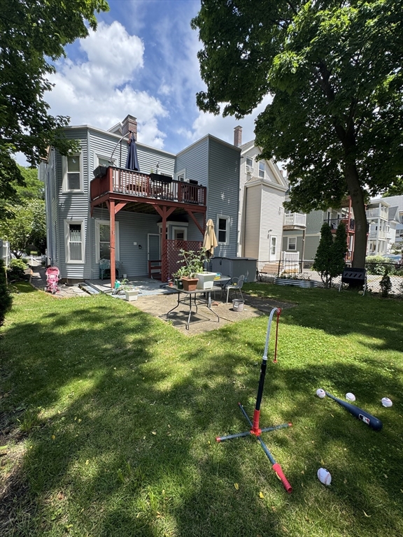 5 Spring Park Avenue, Unit 1 Boston, MA 02130 - Photo 21 of 24 a front view of house with yard and outdoor seating