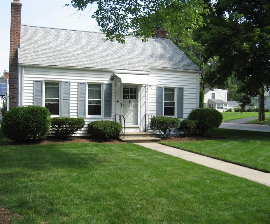 34 Mayflower Road Springfield, MA 01118 - Photo 1 of 23 a view of a house with a yard and plants