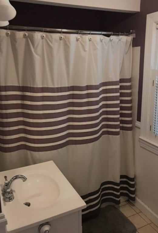 34 Mayflower Road Springfield, MA 01118 - Photo 23 of 23 a bathroom with a sink and a mirror