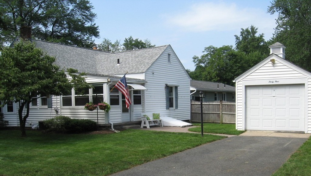 34 Mayflower Road Springfield, MA 01118 - Photo 6 of 23 a front view of a house with a yard
