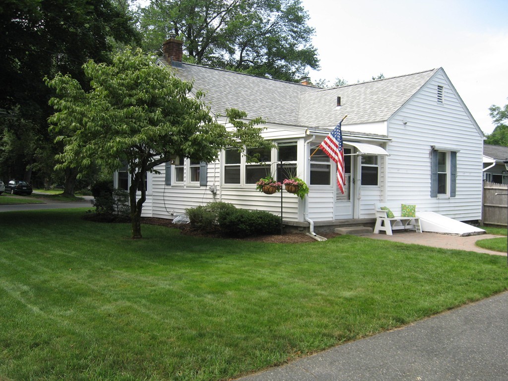 34 Mayflower Road Springfield, MA 01118 - Photo 7 of 23 a front view of house with yard and green space