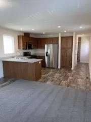a kitchen with a refrigerator sink and microwave