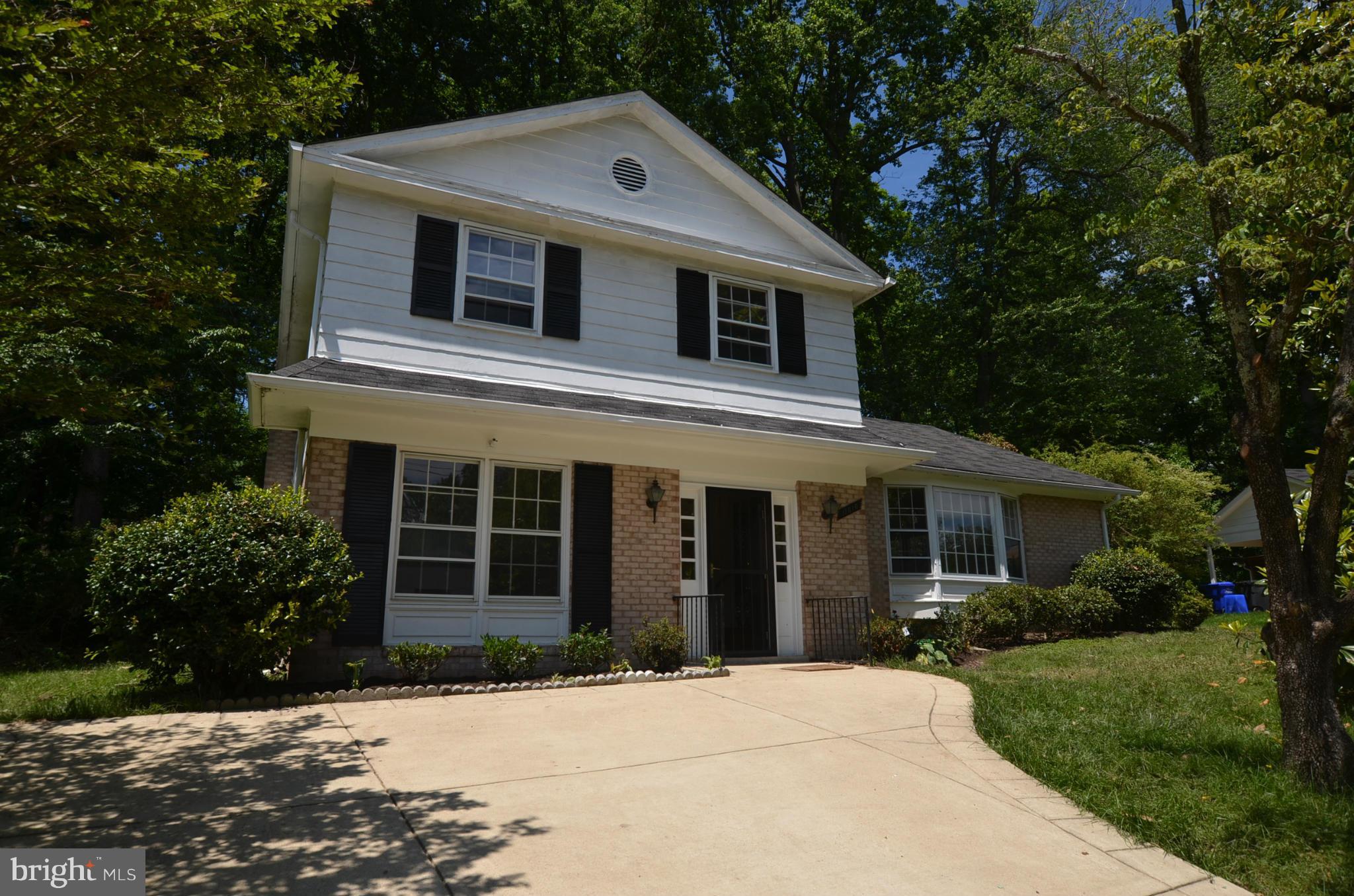 11810 Coldstream Drive Potomac, MD 20854 - Photo 1 of 13 a front view of a house with a yard
