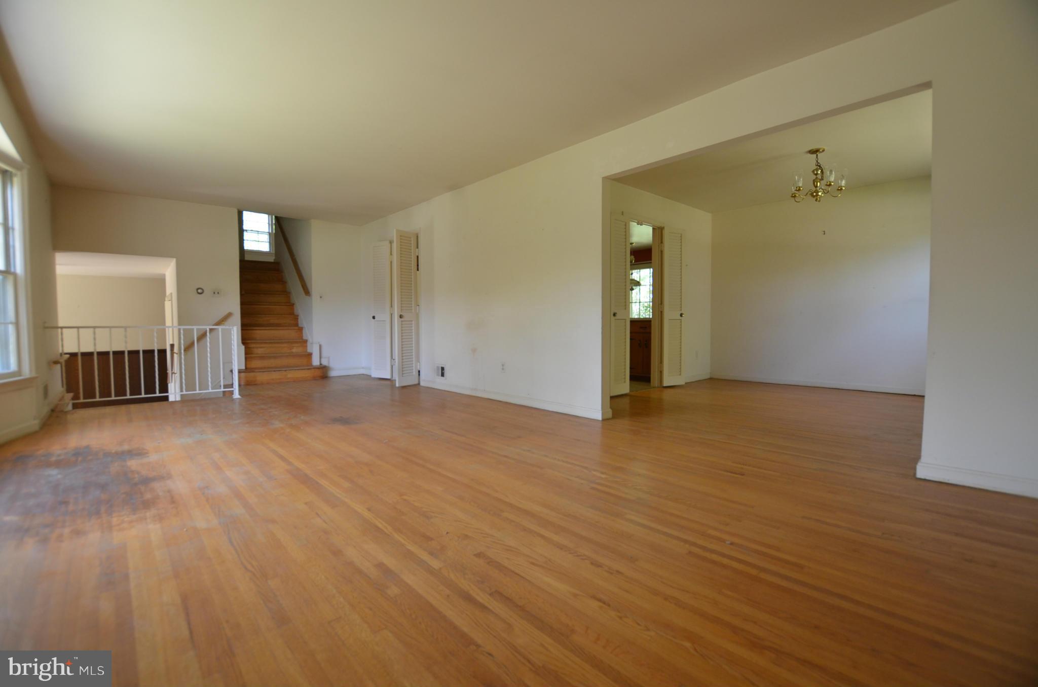 11810 Coldstream Drive Potomac, MD 20854 - Photo 7 of 13 an empty room with wooden floor and bathroom