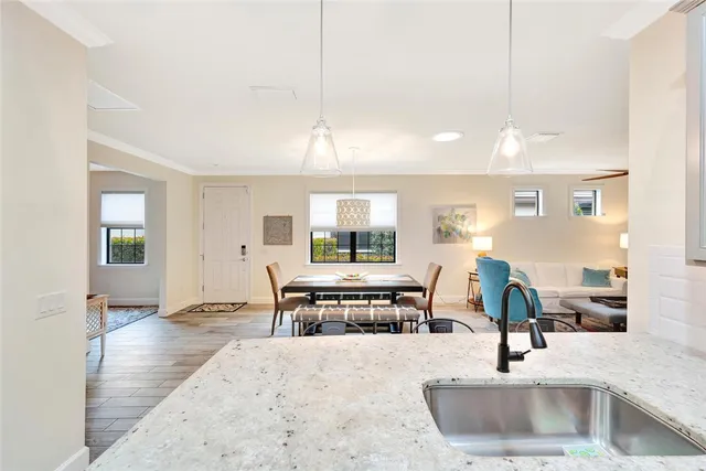 a kitchen with a sink and a refrigerator