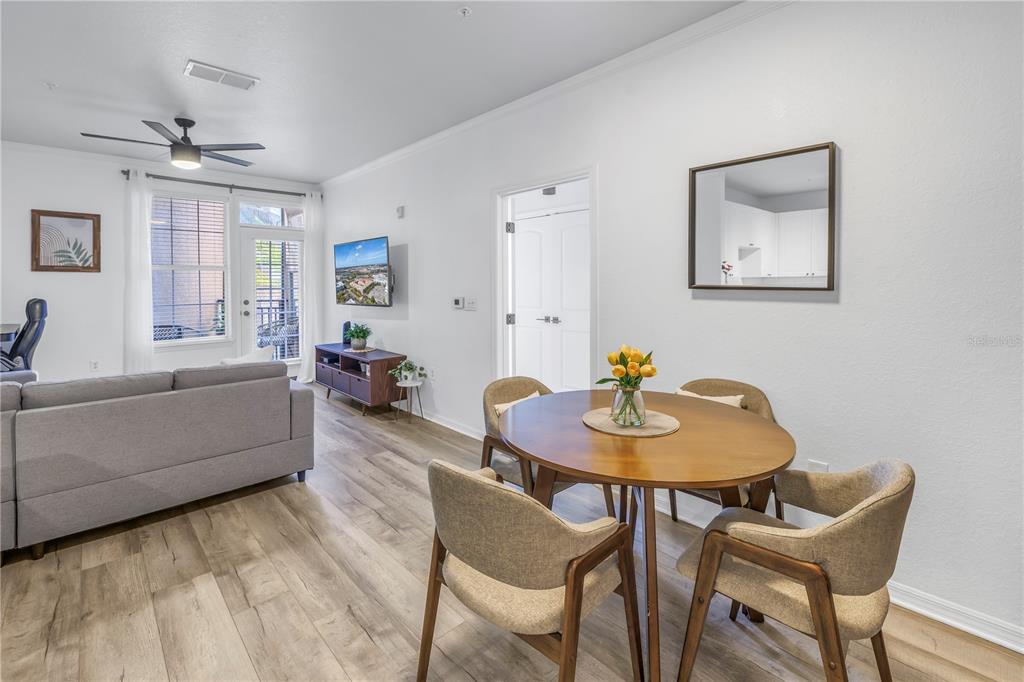 4221 West Spruce Street, Unit 1325 Tampa, FL 33607 - Photo 14 of 35 a living room with furniture and a table