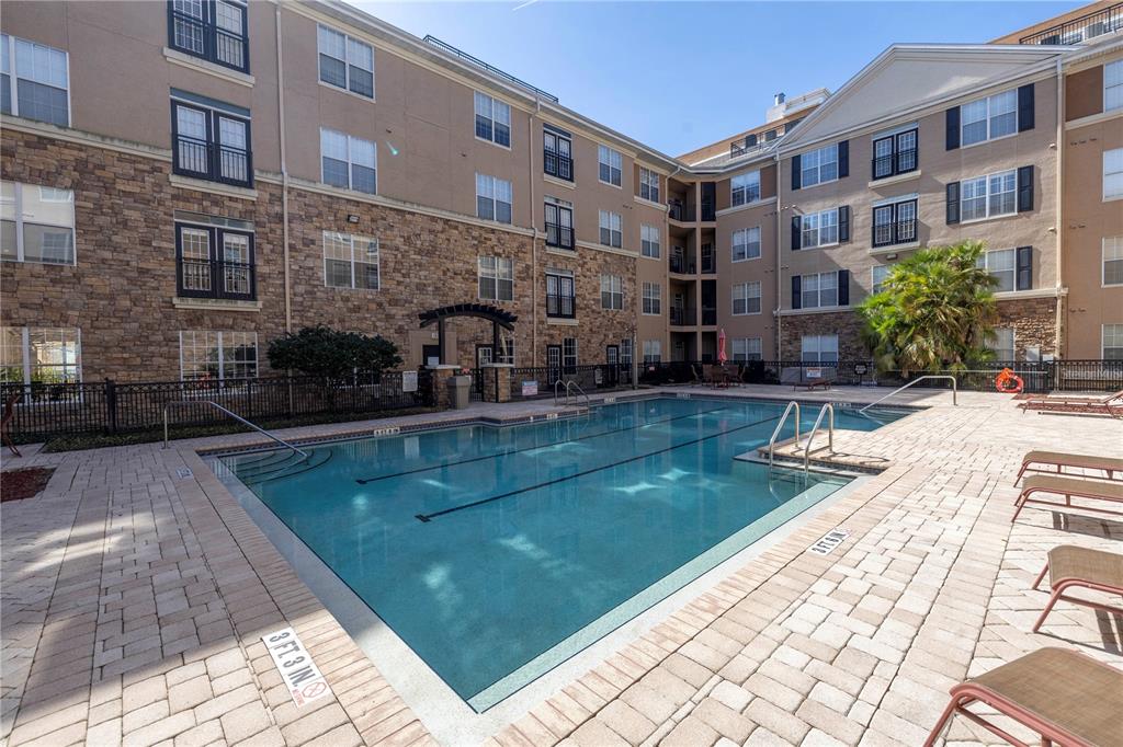 4221 West Spruce Street, Unit 1325 Tampa, FL 33607 - Photo 28 of 35 a view of a building with garden