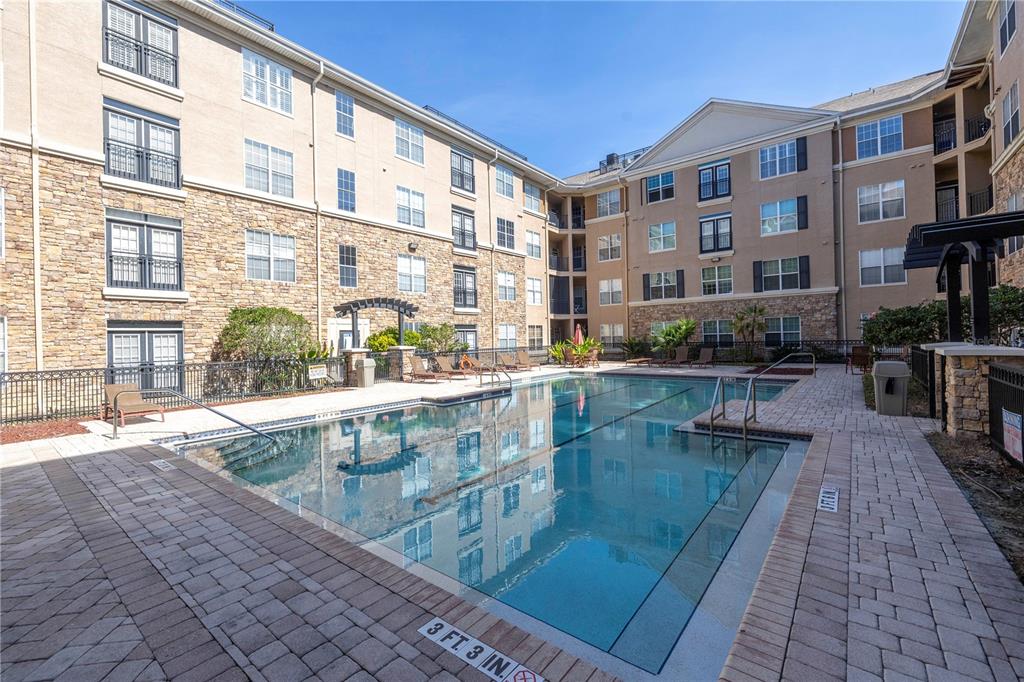 4221 West Spruce Street, Unit 1325 Tampa, FL 33607 - Photo 30 of 35 a swimming pool view with a outdoor seating