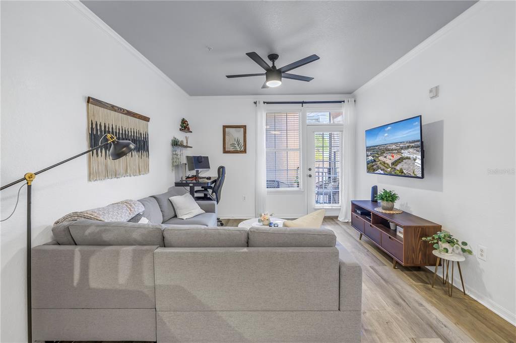 4221 West Spruce Street, Unit 1325 Tampa, FL 33607 - Photo 6 of 35 a living room with furniture and a window