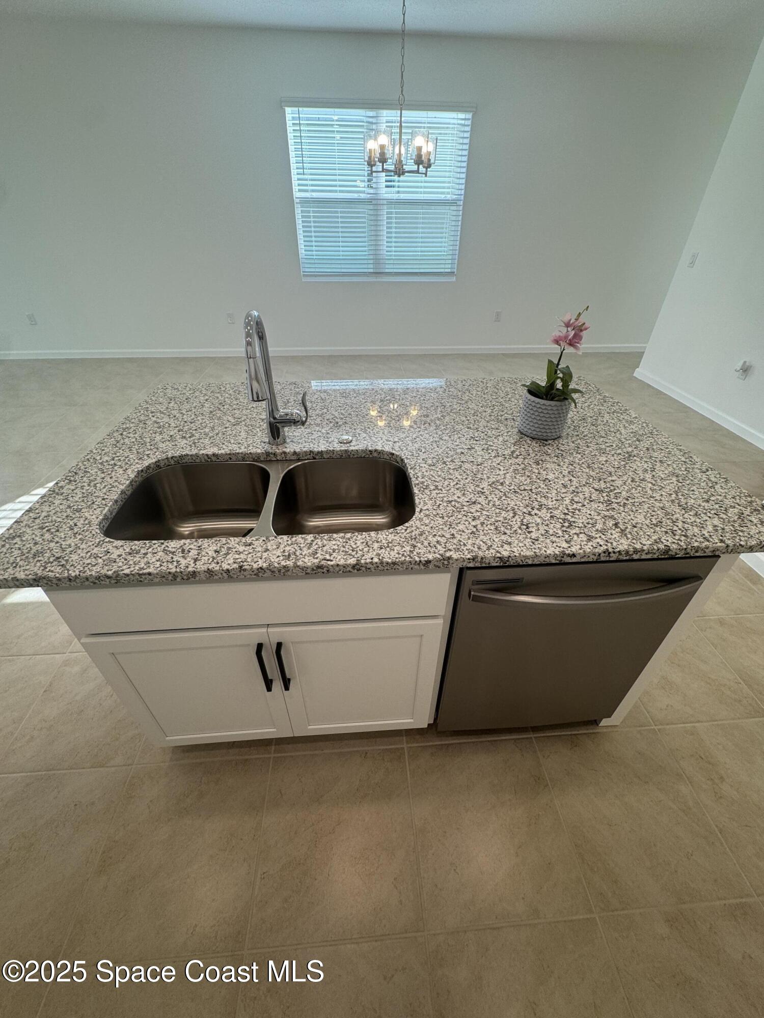 1041 Canfield Circle Palm Bay, FL 32909 - Photo 13 of 57 a close view of sink and tap