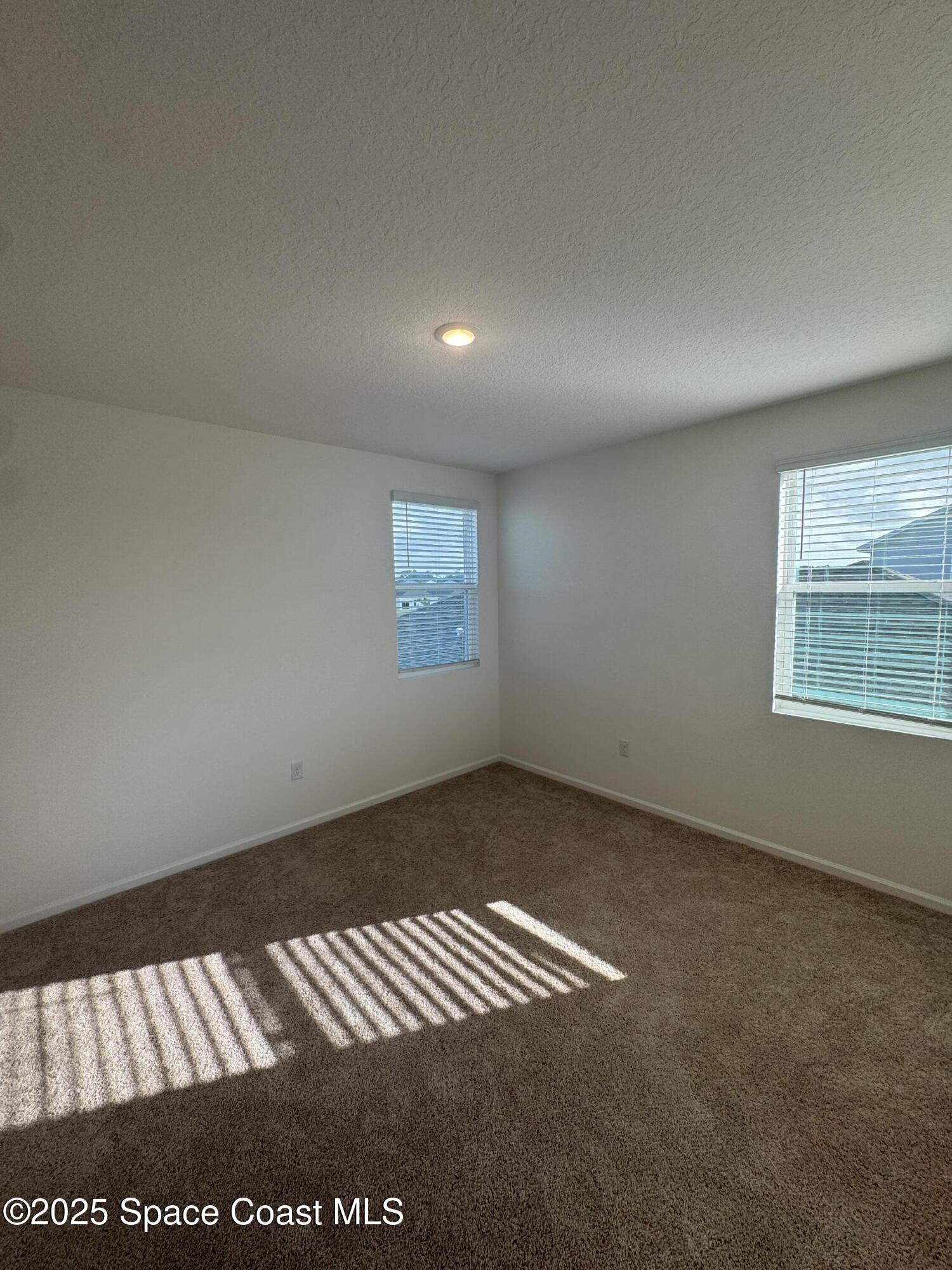 1041 Canfield Circle Palm Bay, FL 32909 - Photo 29 of 57 an empty room with a window