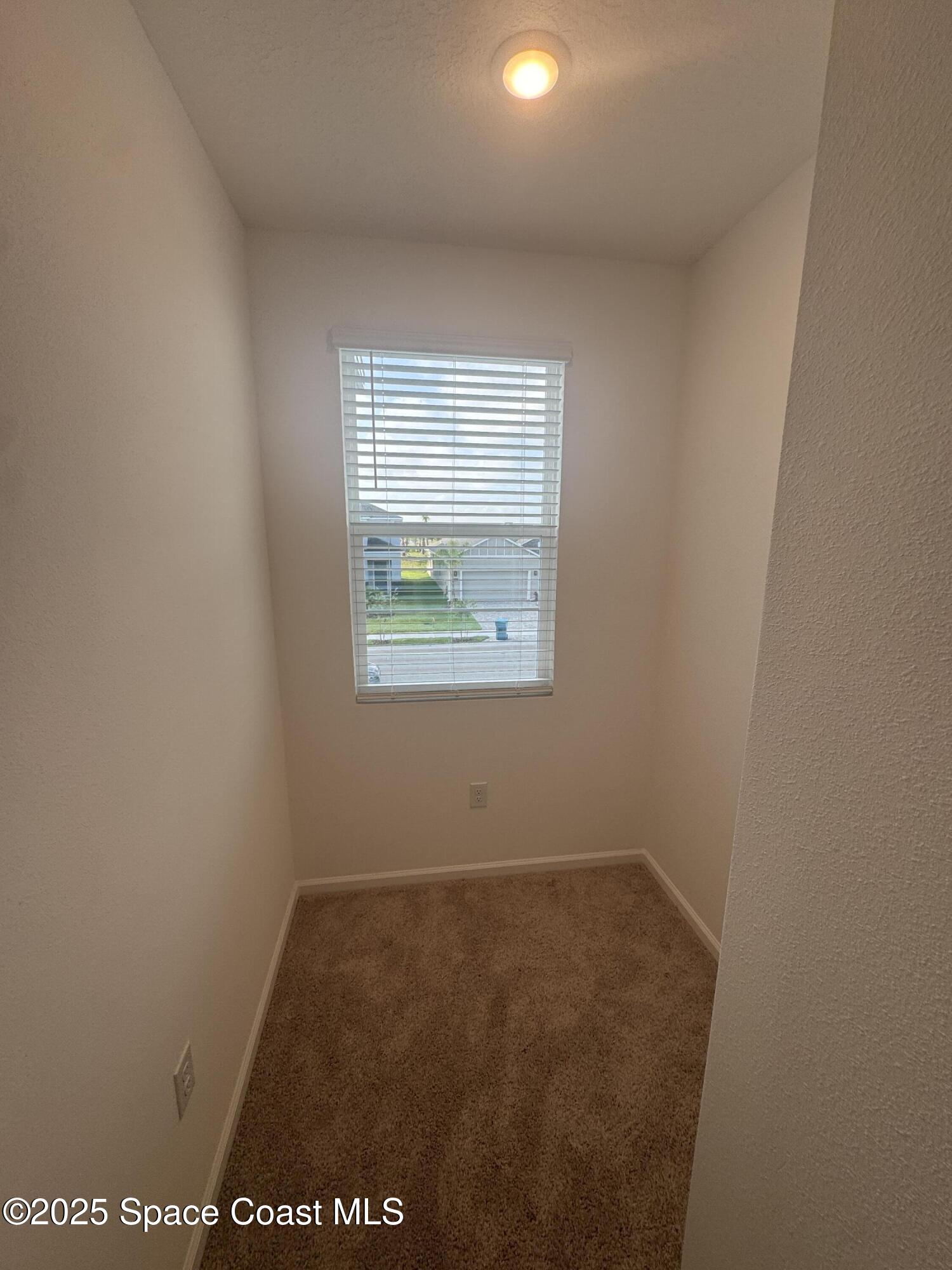 1041 Canfield Circle Palm Bay, FL 32909 - Photo 31 of 57 an empty room with a window