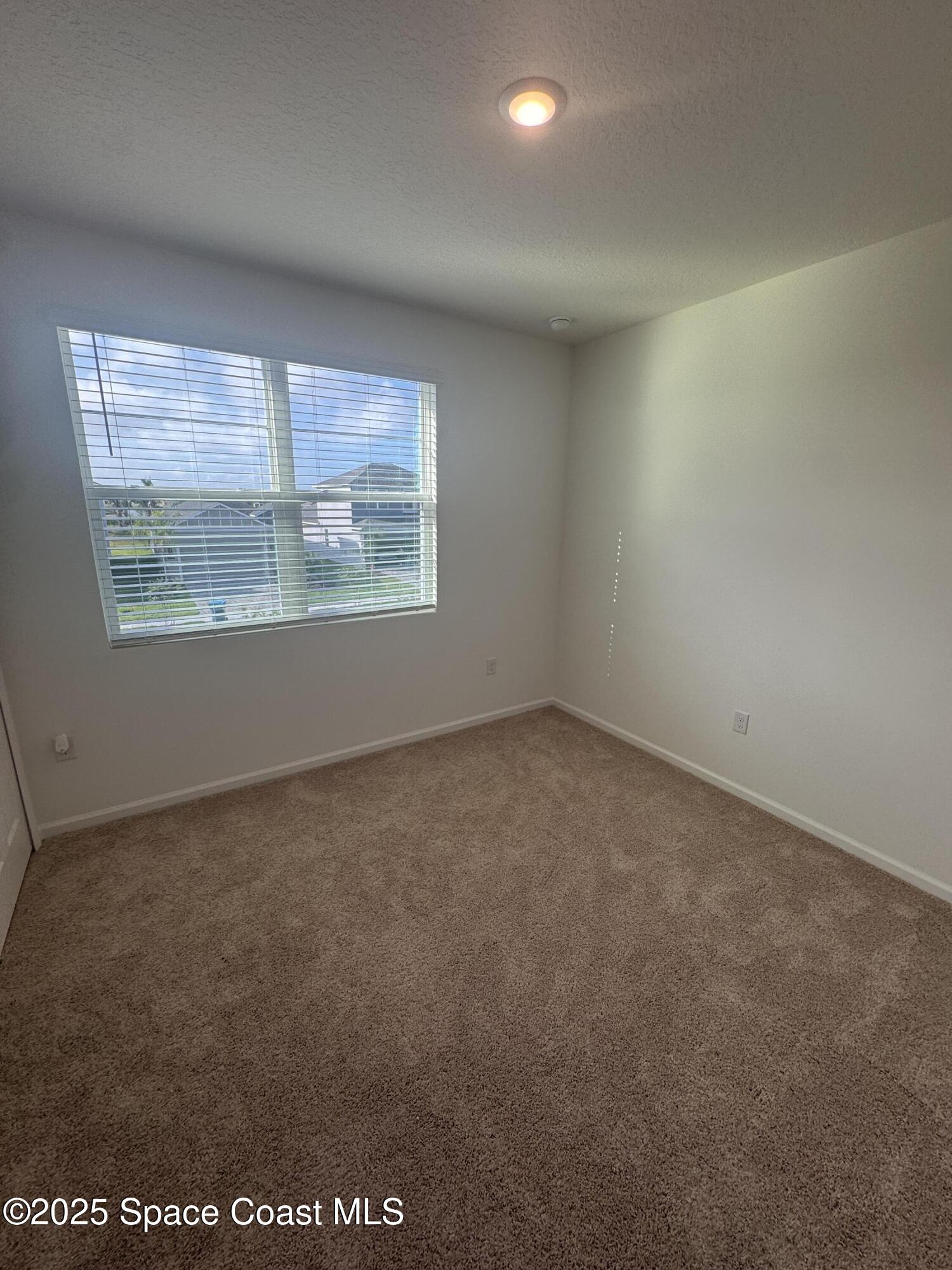 1041 Canfield Circle Palm Bay, FL 32909 - Photo 33 of 57 an empty room with a window
