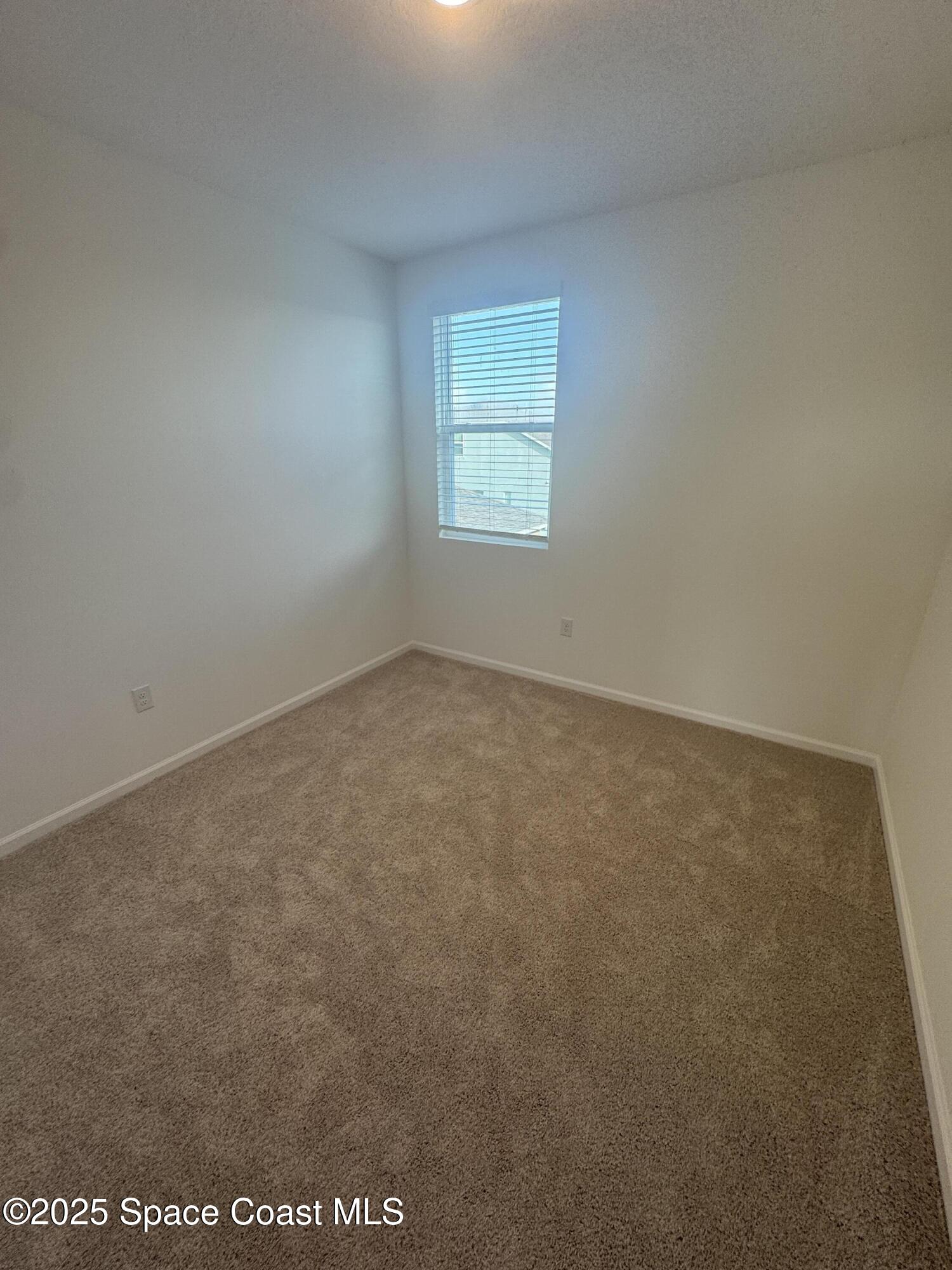 1041 Canfield Circle Palm Bay, FL 32909 - Photo 35 of 57 an empty room with a window