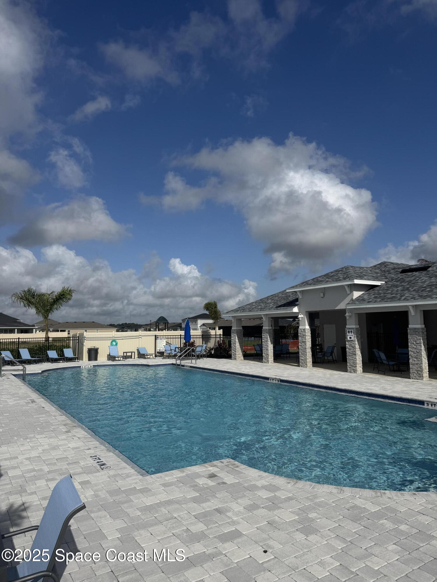 1041 Canfield Circle Palm Bay, FL 32909 - Photo 55 of 57 a view of a house with a yard and sitting area