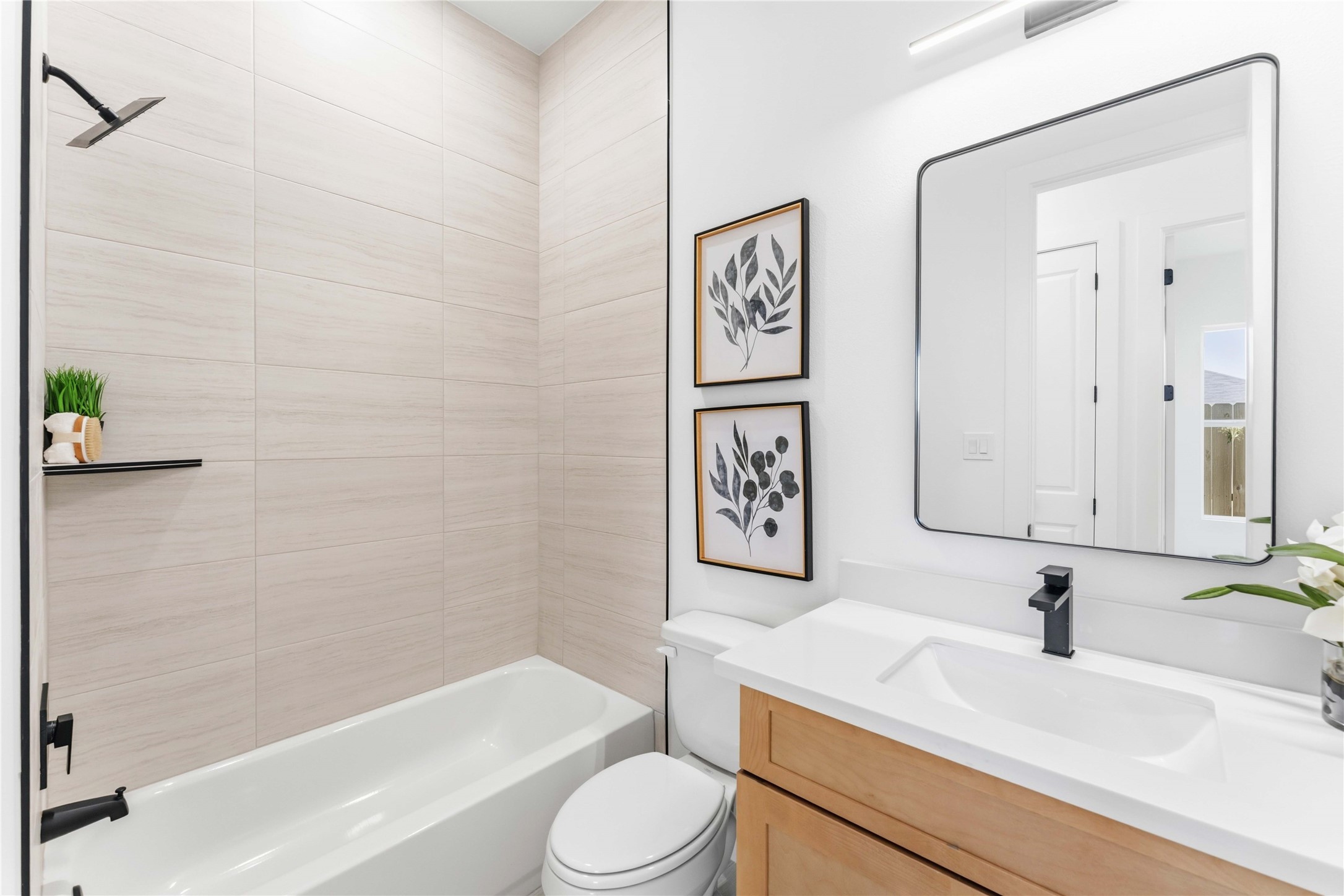 5423 Manton Street, Unit AB Houston, TX 77028 - Photo 15 of 25 a bathroom with a sink a toilet and shower