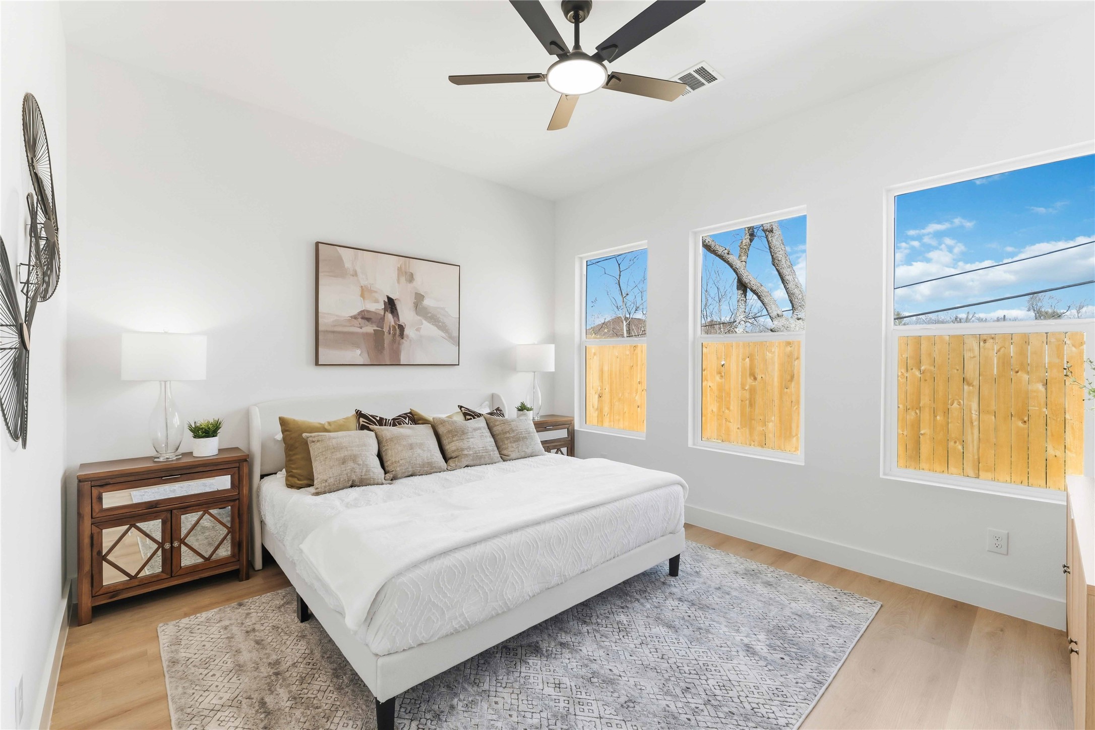 5423 Manton Street, Unit AB Houston, TX 77028 - Photo 19 of 25 a bedroom with a bed a couch and a window