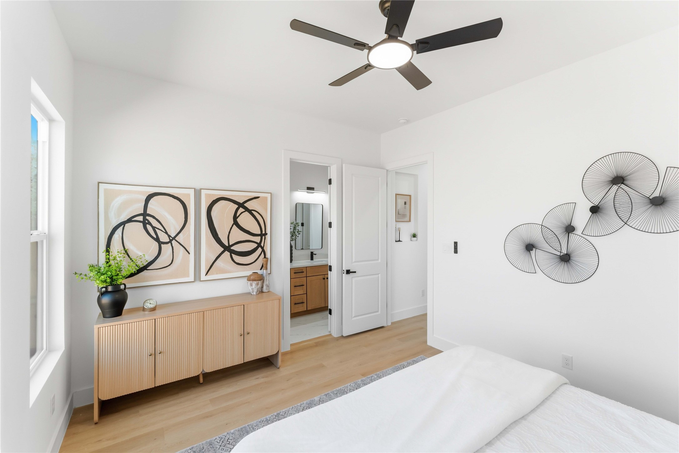5423 Manton Street, Unit AB Houston, TX 77028 - Photo 20 of 25 a bedroom with a bed and a chandelier