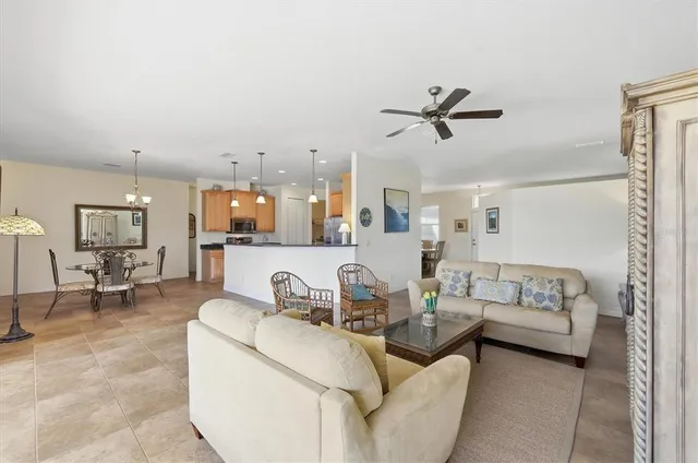 a view of a swimming pool with a yard and outdoor seating
