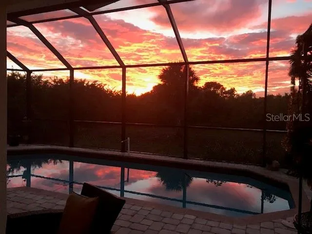 a house with a yard and a large tree