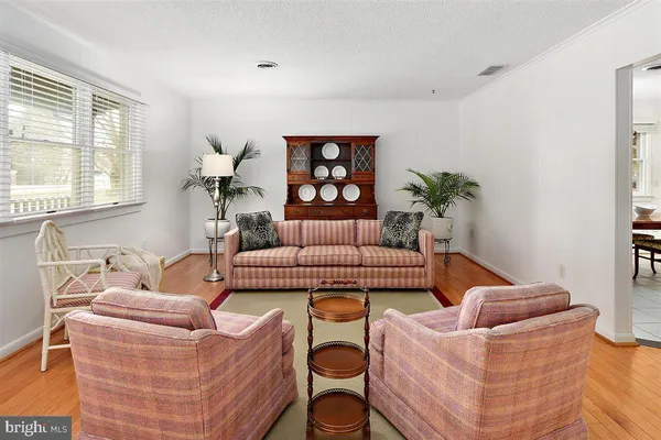 a living room with furniture and window