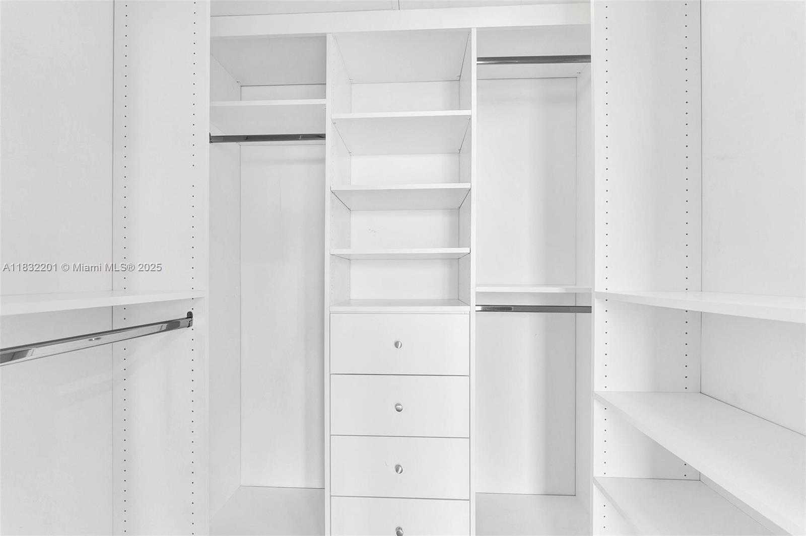 60 Southwest 13th Street, Unit 3400 Miami, FL 33130 - Photo 17 of 50 a view of walk in closet with empty racks