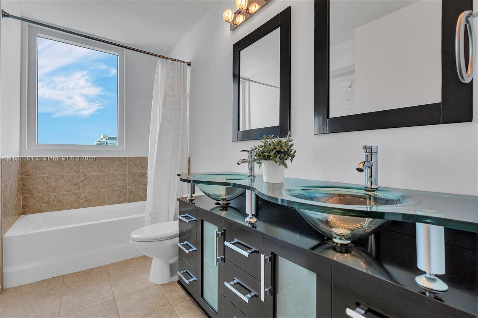 60 Southwest 13th Street, Unit 3400 Miami, FL 33130 - Photo 22 of 50 a bathroom with a sink a toilet and a bathtub