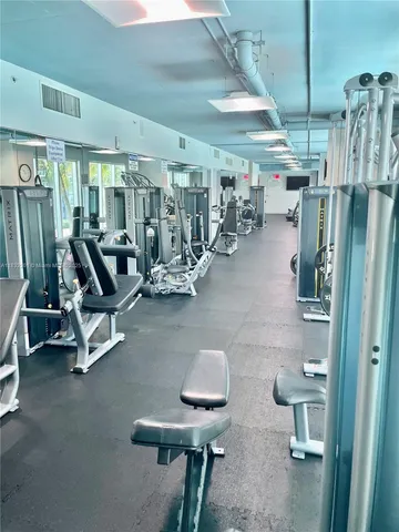 a room with furniture and gym equipment