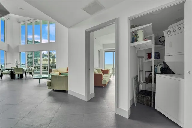 a kitchen with stainless steel appliances a refrigerator sink and cabinets