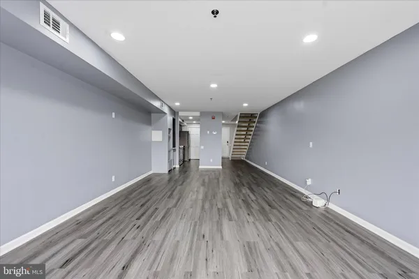 a view of gallery with wooden floor