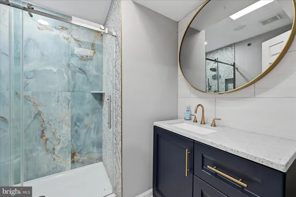 a bathroom with a sink and a mirror