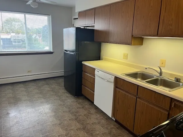 a utility room with sink dryer and washer