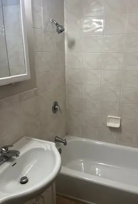 a bathroom with a sink and a bathtub