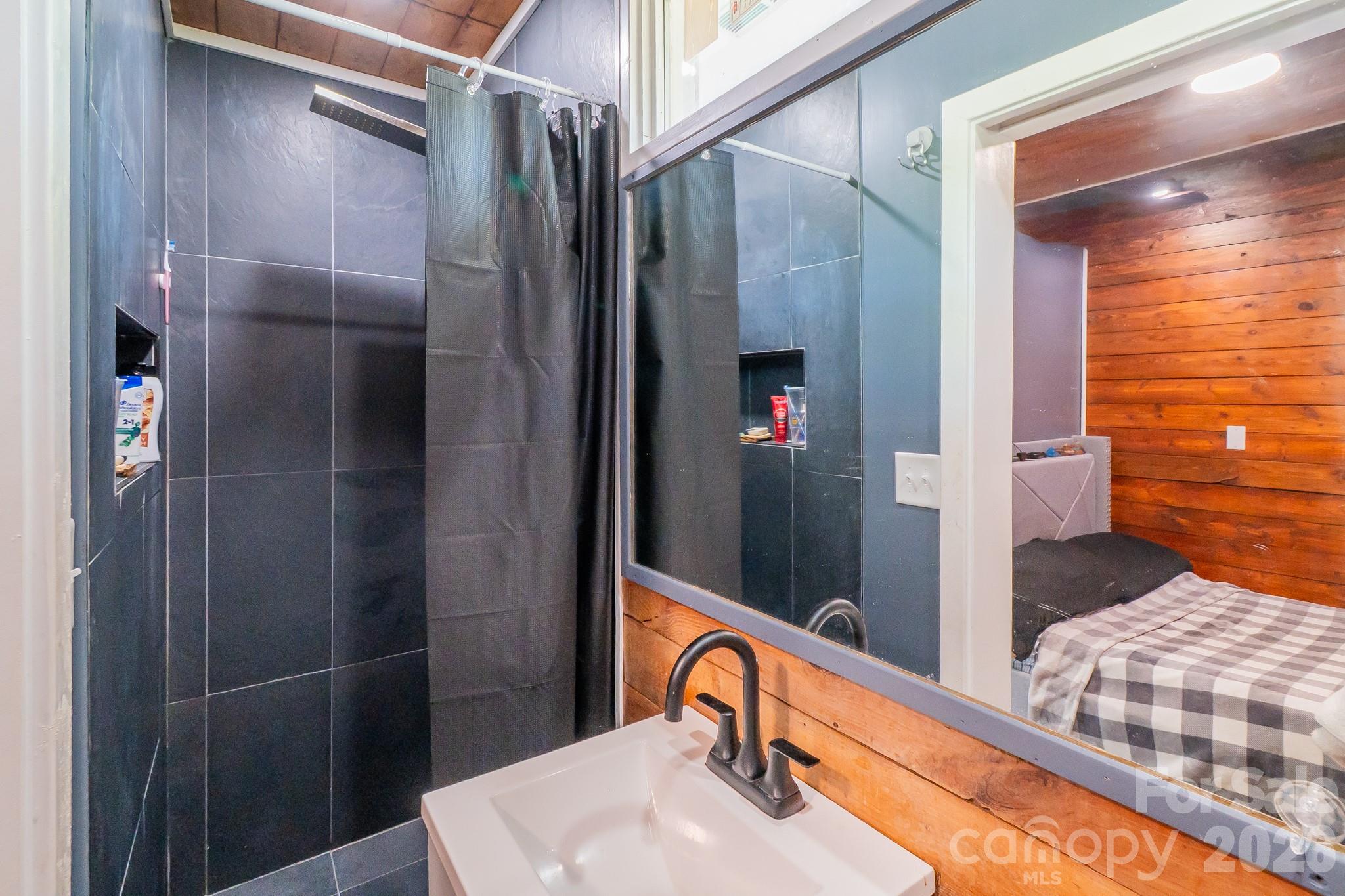 306 Ridge Street Stanley, NC 28164 - Photo 38 of 44 a bathroom with a sink and a mirror