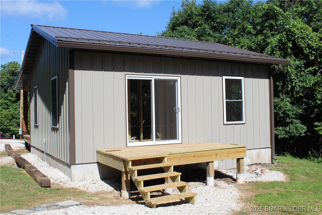 28511 Cody Road Stover, MO 65078 - Photo 6 of 26 rear of house of showing sliding door to bedroom