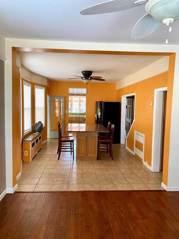 13 Deane Street Fairhaven, MA 02719 - Photo 6 of 28 a living room with furniture and a table