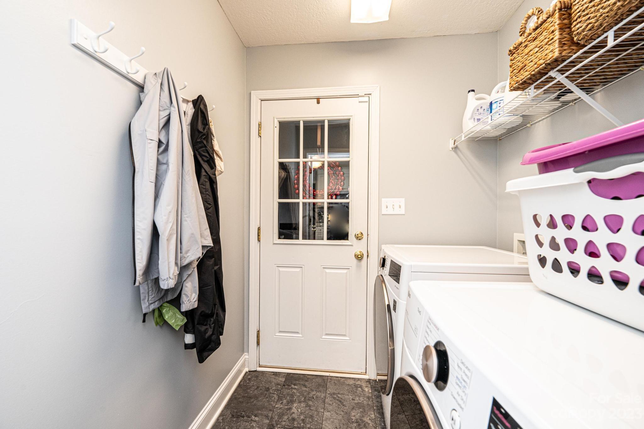 4875 Water Wheel Drive Conover, NC 28613 - Photo 16 of 33 a view of walk in closet with clothes and shoes